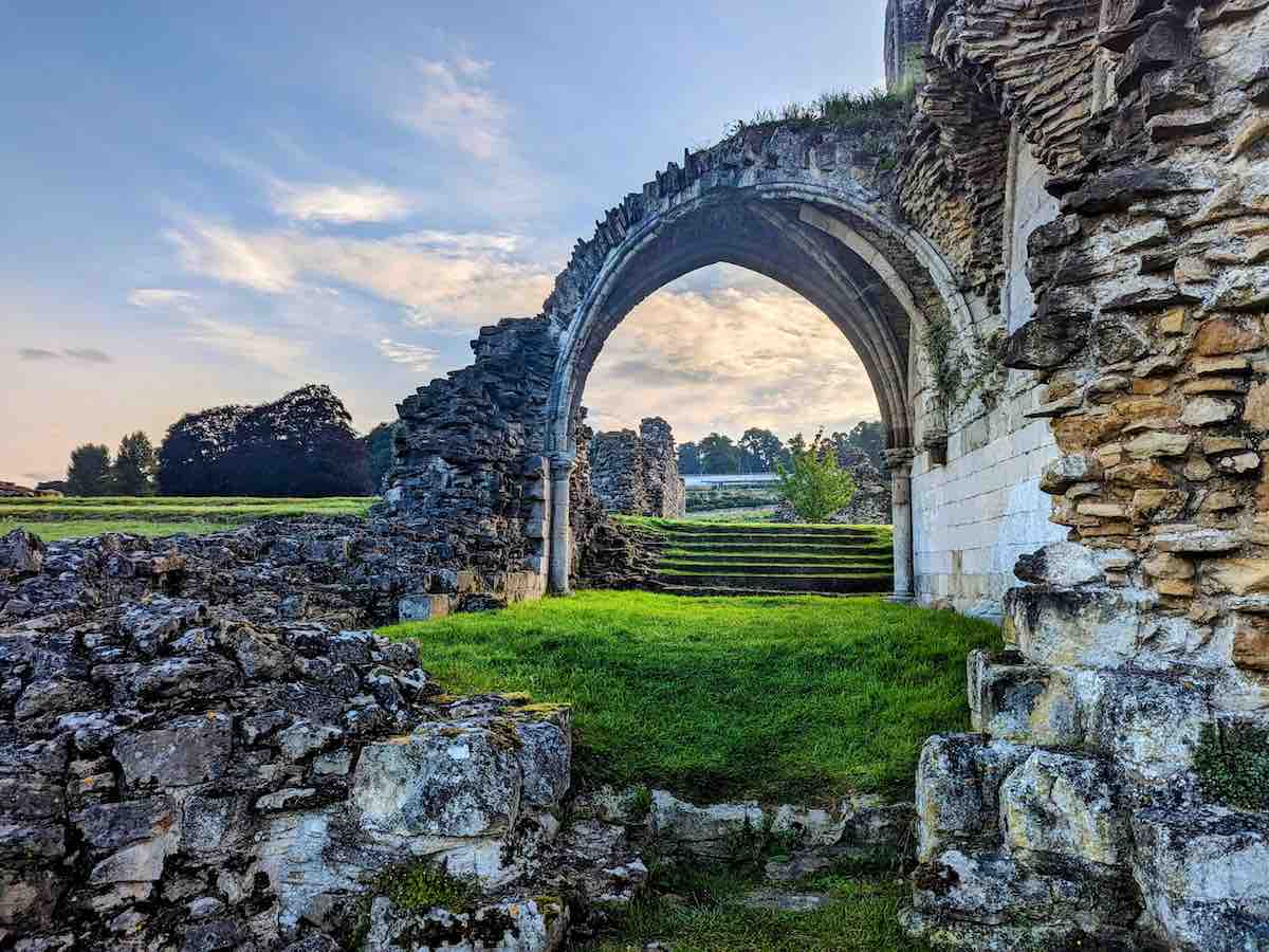 English Heritage Kirkham Priory ruins and archway on a beautifully sunny day