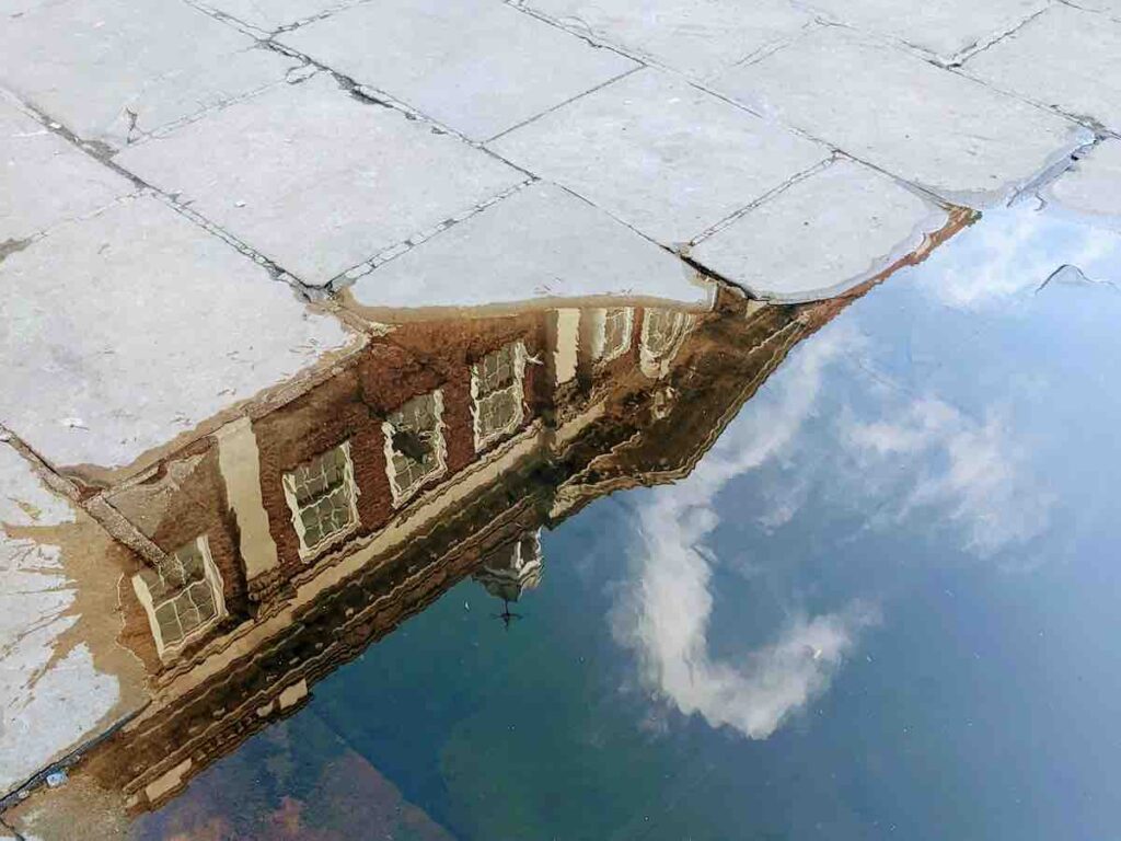 Reflection of York Mansion House in a puddle, taken on a rainy run