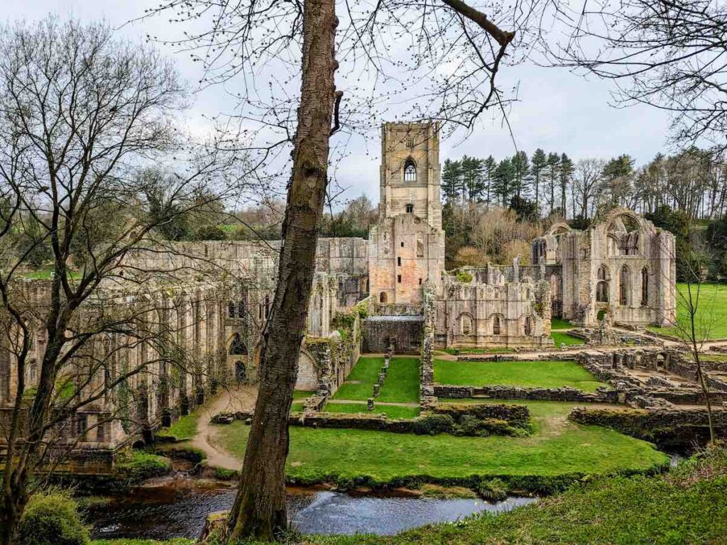 View of the Fountains Abbey parkrun route, ruins and cloisters from the parkrun route