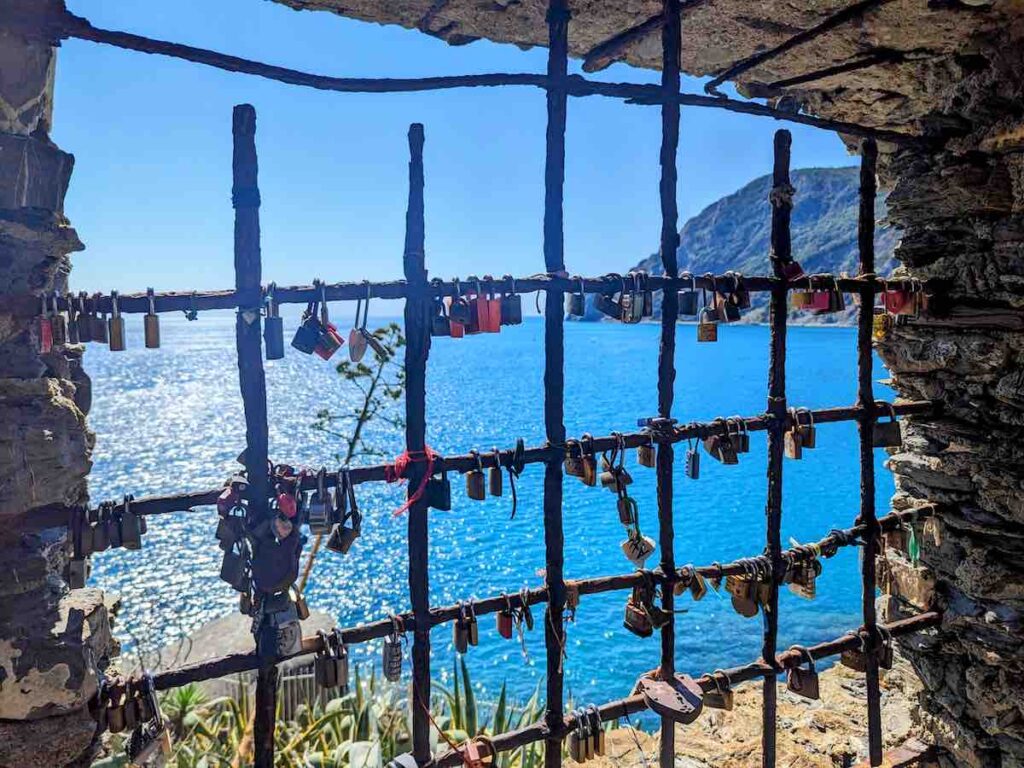 Panoramic 'window' of Punta Mesco with love locks in Cinque Terre overlooking the Med Sea